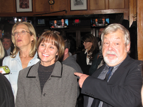 Julie Lofstad, center, celebrates her victory with Councilman John Bouvier, right, and County Legislator Bridget Fleming, left. 