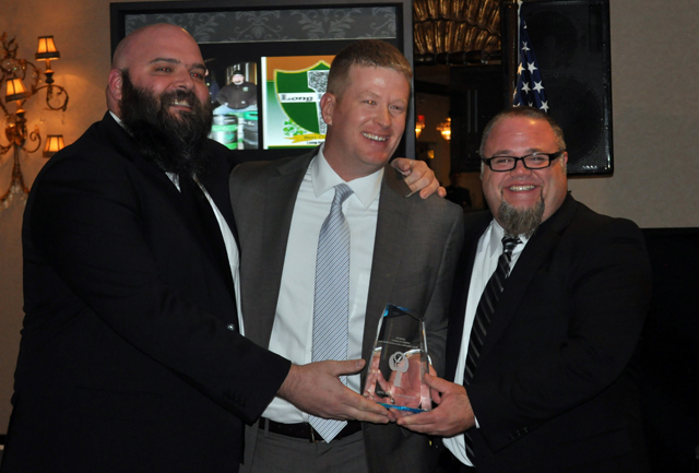 New chamber of commerce president Brian Curtin, center, presented the Entrepreneurial Achievement Award to Long Irleand co-owners Dan Burke (left) and Greg Martin in December. (Joseph Pinciaro file photo)