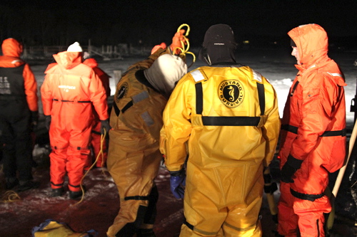 Firefighters venturing off onto the ice wore Mustang suits to protect them from the icy waters.