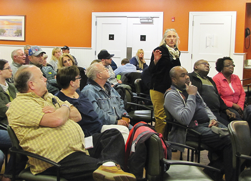 Flanders resident Chrissy Prete speaks out against a proposal to establish a municipal garbage district in the Flanders, Riverside and Northampton hamlets during a presentation on the plan at Friday's Waters Edge Civic Association meeting. (Credit: Tim Gannon)