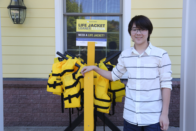 Southold 12-year-old Miles Eisenberg has been building life jacket stands Sea Tow that will be distributed around the country. (Credit: Krysten Massa)
