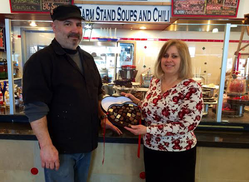 RACHEL YOUNG PHOTO | North Fork Chocolate Company owner Ann Corley, right, with executive chef Steve Amaral at their Tanger Outlets location Tuesday. 