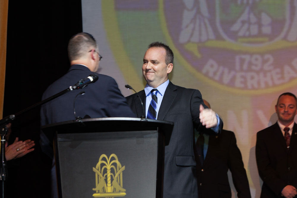 Dickson Palmer presents the PBA Member of the Year award to Officer Christopher Parkin.  (Credit: Katharine Schroeder)