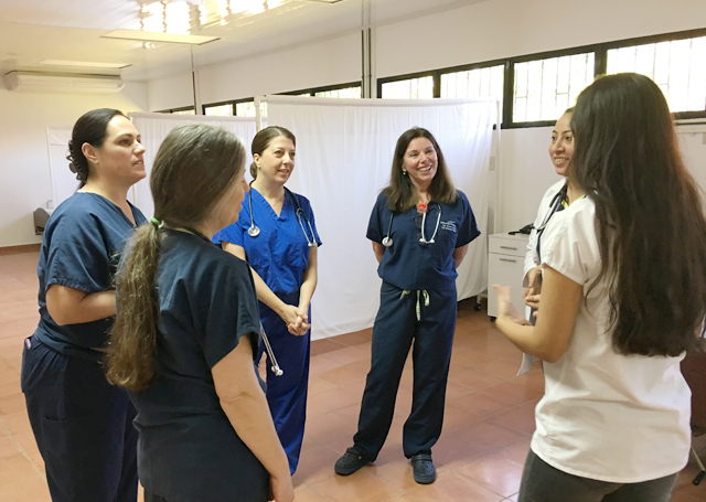 Nurses from PBMC talk with local staff and learn about the center in Jacuapa, El Salvador. (Credit: Laura Kelly)