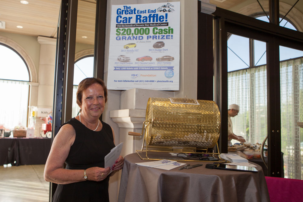 Stacy Higgins from the Peconic Bay Medical Center Foundation office mans the car raffle station.