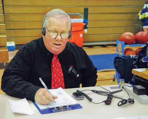 BILL LANDON PHOTO | Pat Kelly has been calling Riverhead football games for 25 years. The voice of the Blue Waves was at West Islip for last Tuesday's boys' basketball game.