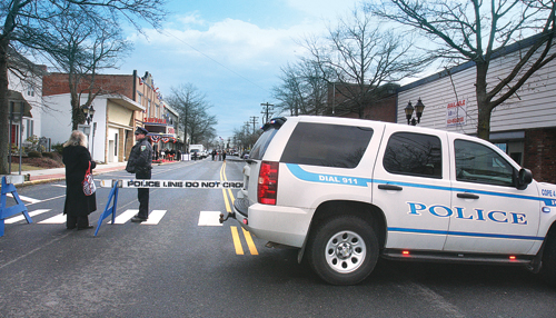 Barbaraellen Koch photo  |  A Riverhead Community Oriented Police Enforcement vehicle blocks off East Main Street for the opening of the Suffolk Theater last year.