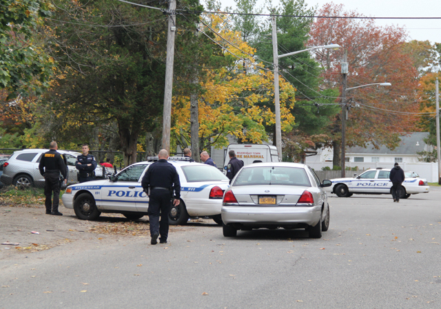Police raid 29 Lewis Street in the Millbrook Gables section of Riverhead Nov. 5. (Credit: Carrie Miller, file)