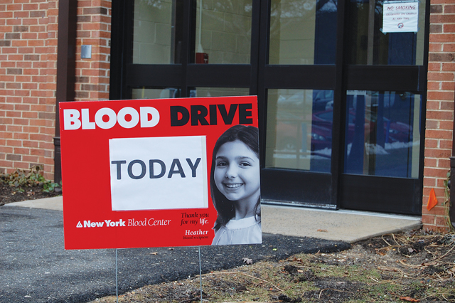 A sign outside SCCC's Peconic Building indicates a blood drive taking place inside. According to the New York Blood Center, someone in the U.S. needs a blood transfusion every three seconds. (Credit: Nicole Smith)