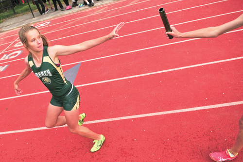 McGann-Mercy sophomore Meg Tuthill reaches back for the baton during a relay event last year. (Credit: Bill Landon, file)