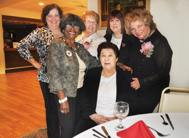 Members (counter-clockwise, from left) Sissy Zosimo, Diann Scott, Joanne Zosimo, Darlene Faith, Marie Donovan and Thelma Booker pose for a photo Saturday at the Madison Street Moose lodge. (Credit: Rachel Young)