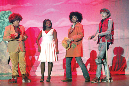 Jesse Goodale (the Lion), Taylor Burgess (Dorothy), Jon Troiano (the Scarecrow) and Alex Bowe (the Tinman) perform in the Blue Masques production of 'The Wiz' at Riverhead High School. (Credit: Riverhead Schools)