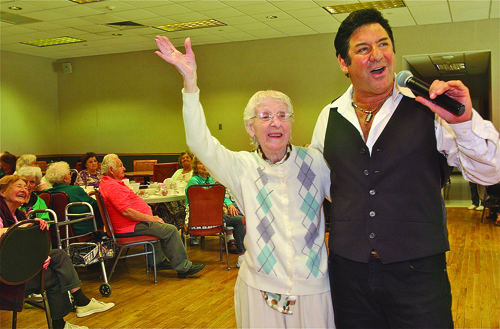 BARBARAELLEN KOCH PHOTOVirginia Messina, 96, of Riverhead, took center stage Thusday afternoon with singer Larry Liso of Aquebogue as he serenaded her with his rendition "I Left my Heart in San Francisco" during the entertainment day for seniors hosted by Riverhead Town at the human resource/senior center Thursday afternoon. Pianist Danny Keyes also performed.