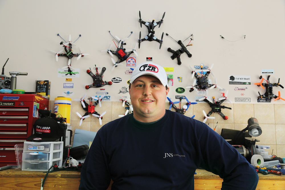 A business owner by day, Mr. Zoumas has custom built his racing drones, which hang on his garage wall. (Credit: Paul Squire)