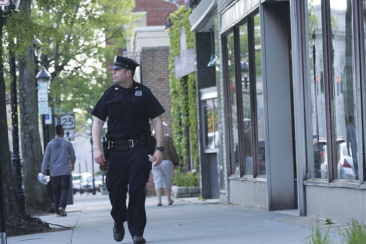 Officer Montalnano walks his beat on East Main Street last week. (Credit: Barbaraellen Koch, file)