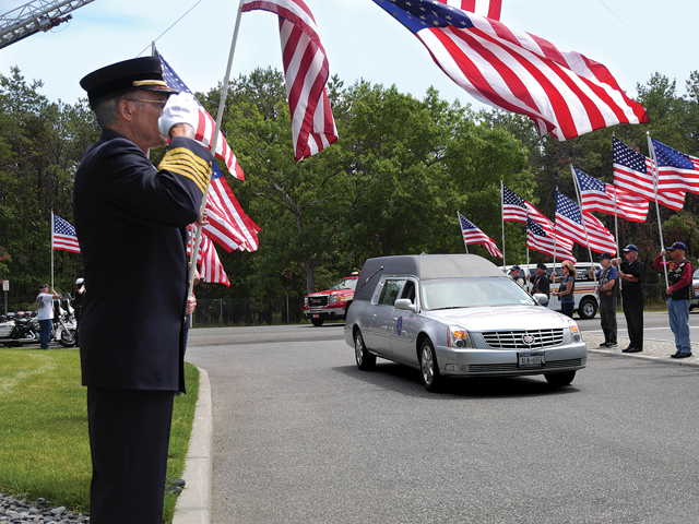Seeing the hearse entering Calverton National Cemetery for the May funeral of Battalion Chief Lawrence Stack was incredibly powerful. He lost his life on Sept. 11, 2001 and his body was never recovered. That day they buried a vial of blood he had donated. (Credit: Krysten Massa)