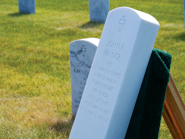 The gravestone of U.S. Marine John Prince at Calverton National Cemetery. (Credit: Krysten Massa)