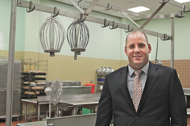Keith Graham, the new food services director for Riverhead School District, in the high school kitchen. Mr. Graham says the district will be able to offer fresher foods to all students once kitchen renovations in each school are completed. (Credit: Jen Nuzzo)