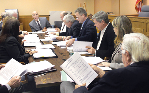 PAUL SQUIRE PHOTO | Riverhead Town Board members (on right) get briefed on the town’s 2012 financial audits last Thursday.