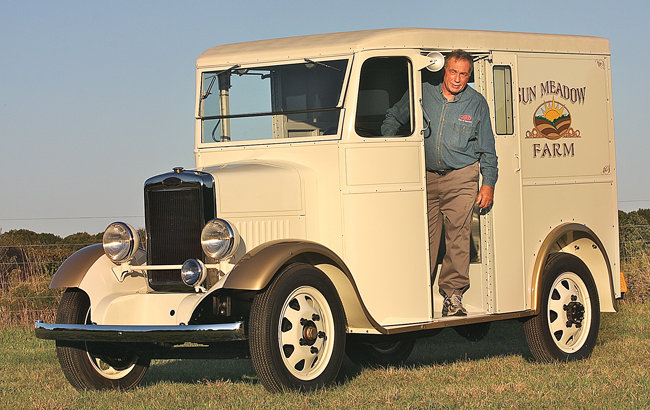 Mr. Rienzo, who serves as the official librarian for the Divco Club of America, poses in his 1937 Divco in the field behind his Calverton home.