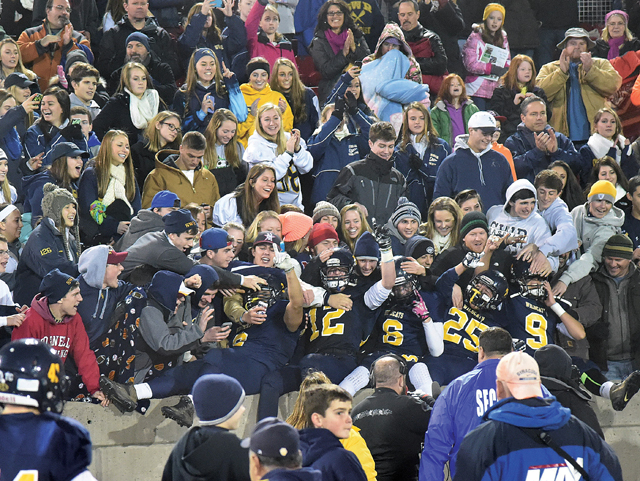 This photo taken after the Shoreham-Wading River football team's L.I. championship victory won in the sports feature photo category in the New York Press Association's Better Newspaper Contest. (Credit: Robert O'Rourk, file)