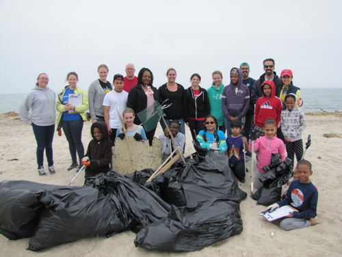 Riverhead Charter School kids filled up several bags with garbage they cleaned at Iron Pier beach Saturday