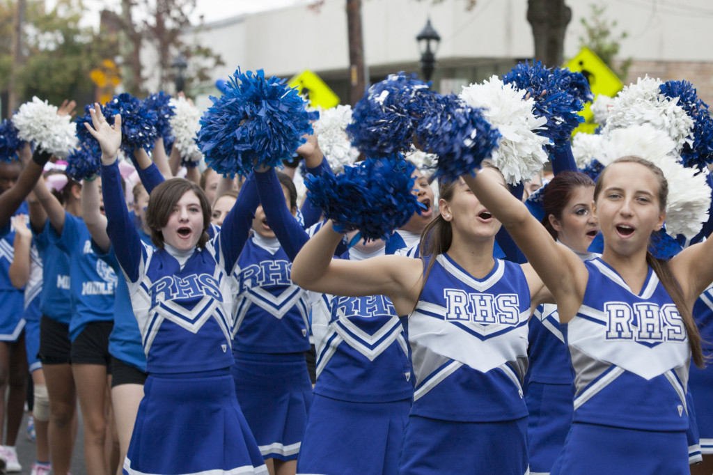 Riverhead cheerleaders march in Saturday's homecoming parade. (Credit: Katharine Schroeder)