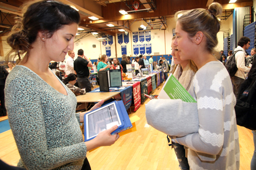RHS Guidance Counselor Anastasia Cobis brought her iPad to the College Fair to help seniors find out if the colleges they took literature from had the their desired major. (Courtesy RCSD)