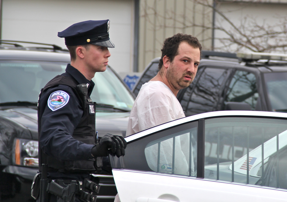 Richard Rause, 30, of Wading River being led to his arraignment Friday morning. (Credit: Carrie MIller)