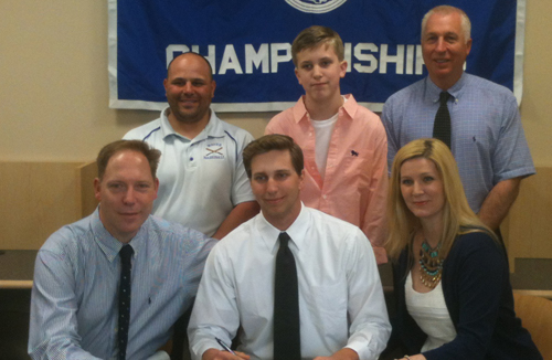 John Wendt III was flanked by his parents, John Jr. and Suzanne, during Friday's signing ceremony. Standing behind them, from left, are Riverhead coach Rob Maccone, Wendt's youngher brother, Riley, and Riverhead athletic director Bill Groth. (Credit: Bob Liepa)