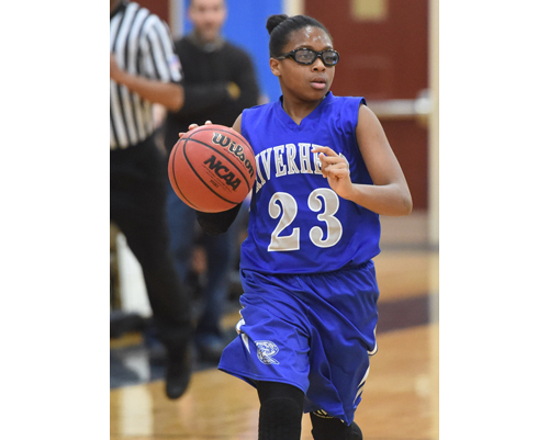 One of Riverhead's starting freshmen, Faith Johnson-DeSilvia, brought the Blue Waves 12 points and 8 rebounds against Eastport/South Manor. (Credit: Robert O'Rourk)
