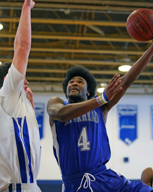 Tyrese Kerr #4 goes up for a shot in the first half against North Babylon. Riverhead was defeated by North Babylon by a score of 56-41 at North Babylon High School on Feb. 11, 2016.  on Feb 3, 2016.