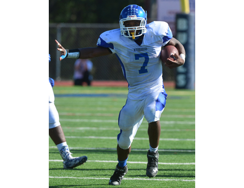 Riverhead's Ryun Moore ran the ball seven times for 55 yards against Smithtown West. (Credit: Robert O'Rourk)