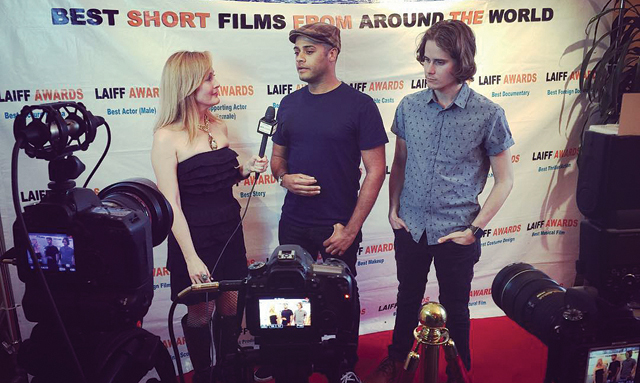 Marc Cartwright, center, is interviewed with his film's star on the red carpet. (Credit: Courtesy)