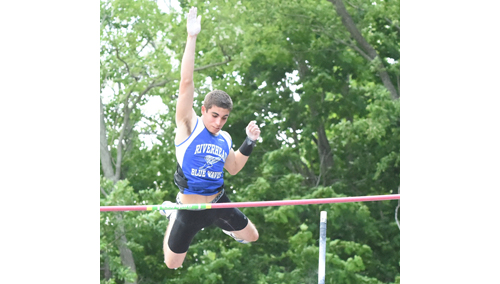 Riverhead pole vaulter Charles Villa clearing 14 feet en route to his triumph Friday at Port Jefferson High School. (Credit: Robert O'Rourk)