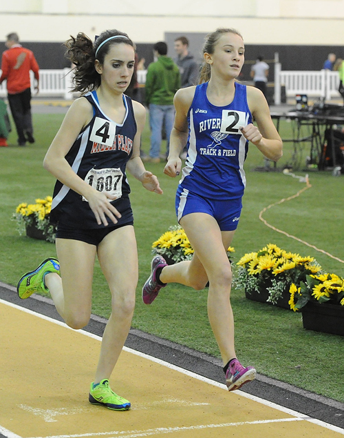 ROBERT O'ROURK PHOTO | Riverhead's Maria Dillingham, right, and Miller Place's Kiera Lopez running side by side in the 600 meters.