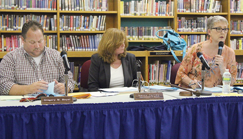 From left, school board vice president Greg Meyer, Superintendent Nancy Carney and board president Ann Cotten-DeGrasse  during a public hearing in August, at which Ms. Carney spoke at length about more planned construction work for the high school.
