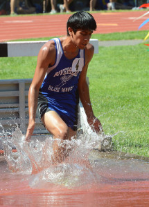 ROBERT O'ROURK PHOTO | Riverhead senior Anthony Galvan made a splash in the 3,000-meter steeplechase, finishing fourth in 10 minutes 9.76 seconds.