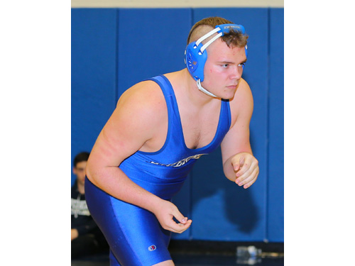 Charles Zaloom of Mattituck (black) defeated Justin Hansel of Riverhead (blue) in the 220 lbs finals of the North Fork Invitational which was held at Mattituck High School on Jan. 31, 2016.