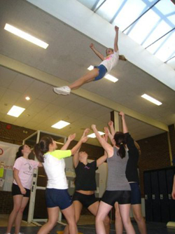 Shoreham cheerleaders practicing stunts in a hallway area in the high school in 2011, which girls at the time contended was not an appropriate space for practice. (Courtesy photo)
