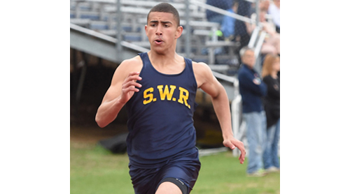 Bryce Casey raced to victory in the 200 meters in 23.3 seconds as undefeated Shoreham-Wading River captured the League VII championship outright. (Credit: Robert O'Rourk)