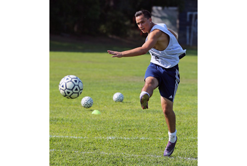 Shoreham-Wading River's top goal scorer from last year, all-county player Doug DeMaio, shooting during a drill at Tuesday's practice. (Credit: Daniel De Mato)