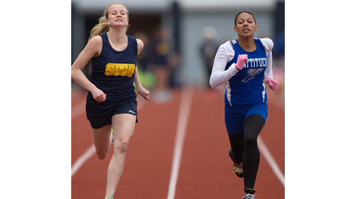Shoreham-Wading River's Courtney Clasen, left, leaned forward at the finish line to nip Mattituck's Desirae Hubbard in the 100 meters. (Credit: Garret Meade).