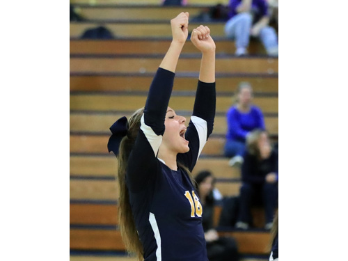 Courtney Wrigley #16 celebrates a point with her teammates during the second set of Shoreham Wading River's three set loss to Sayville at Shoreham Wading River High School in Shoreham on Oct. 27, 2016.