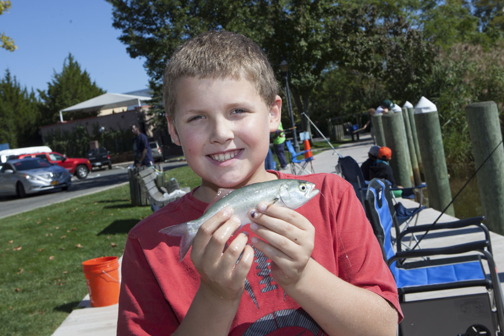 Charlie Liles, 9, of Riverhead holds up his 7 7/8" snapper.