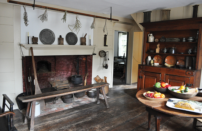The Thomas Moore House, built around 1750 and named for the original owner of the land, is one of the historical society's oldest properties. The cape-style house has been fully restored to reflect life in the 18th century and features an original stove, pictured here. A room at the back of the house that functioned as a kitchen in the 1800s now contains a large loom used to exhibit examples of early weaving. (Credit: Rachel Young)