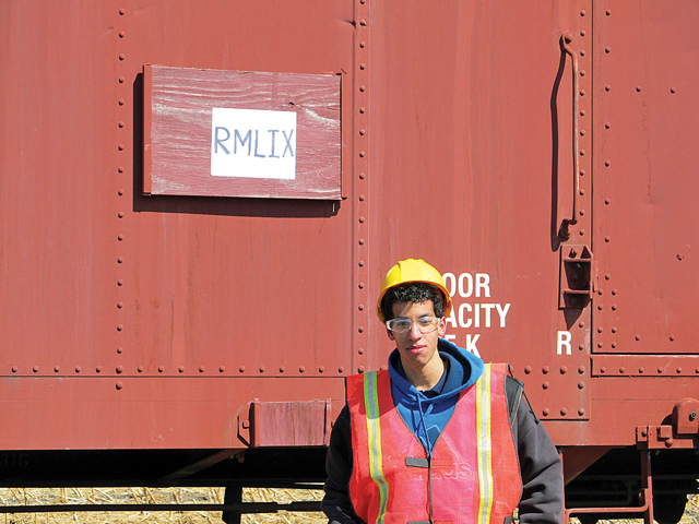 Cameron Wolk, 16, a junior at Half Hollow Hills West High School, spent months calling railroad companies across the country searching for a boxcar. He's volunteered at the Riverhead railroad museum since 2013. (Credit: Courtesy photo)