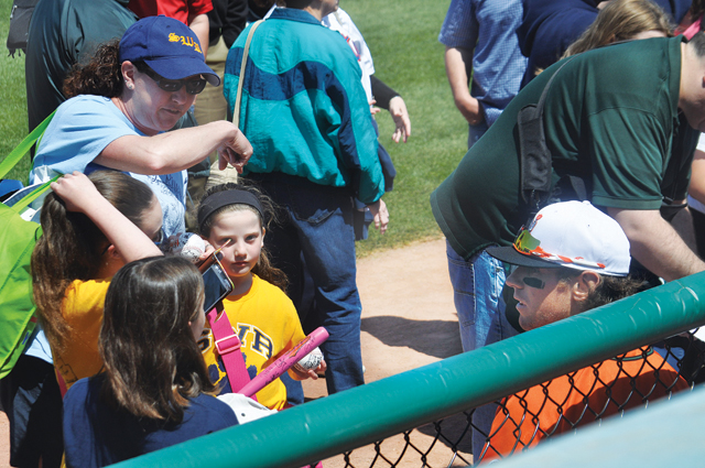 Bryan Sabatella signs autographs for a group of students from Wading RIver Elementary School. (Credit: Grant Parpan)