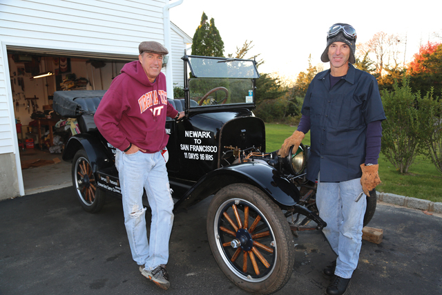 Rich Bassemir (left) and his brother Doug with their 1917 Maxwell touring car in Aquebogue last Friday. (Credit: Krysten Massa)