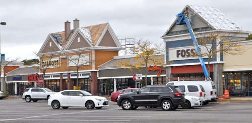 In June, work began to renovate Tanger 2 at Tanger Outlets in Riverhead. The upgrades include new storefront facades and gabled roofs. (Rachel Young photo)
